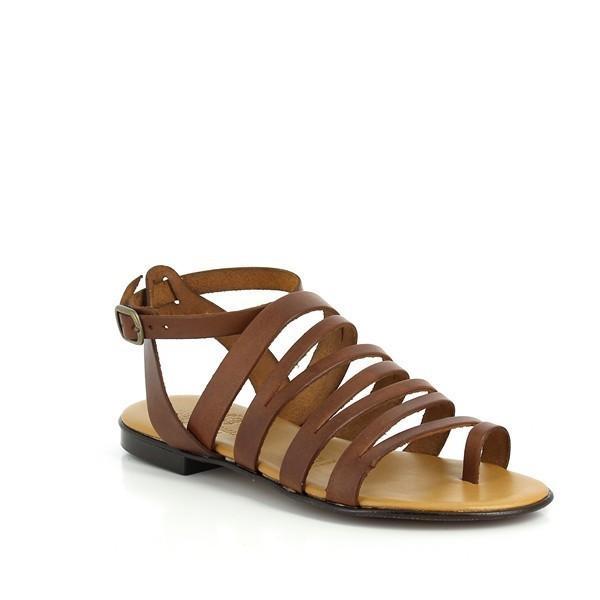 From a slightly angled perspective, the shoe reveals its sleek profile, with the slender leather straps crossing the foot comfortably. The subtle curve of the footbed is visible, indicating the ergonomic design for enhanced comfort. The tan leather beautifully contrasts with the synthetic sole, and the stitching along the edges exemplifies the detailed handwork that went into creating the sandal.