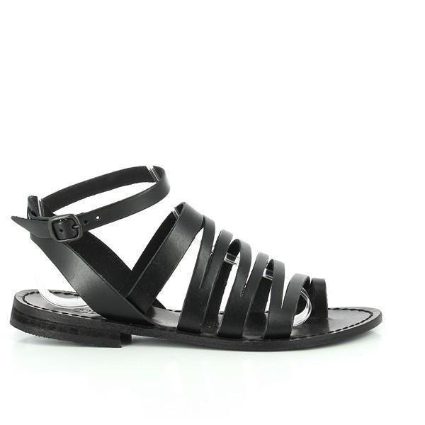 The side angle highlights the smooth, premium black leather upper, with the sleek silhouette enhanced by the finely stitched edges. The adjustable slingback strap curves gracefully around the heel, secured by a small metallic buckle. The subtle 1cm platform adds a touch of elevation while maintaining comfort.