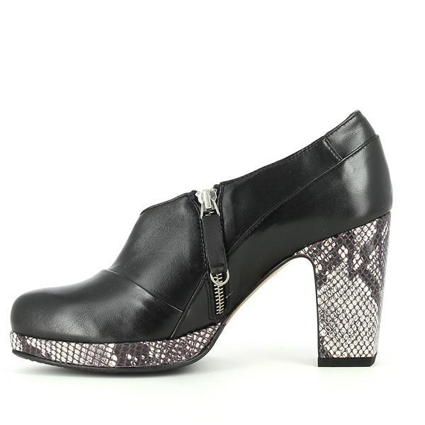 The internal side of the booties features a soft leather lining that ensures comfort for all-day wear. The internal zipper is discreetly integrated, providing easy access while maintaining the sleek aesthetic of the shoe. This side view showcases the clean lines and high-quality craftsmanship that Audley is known for.