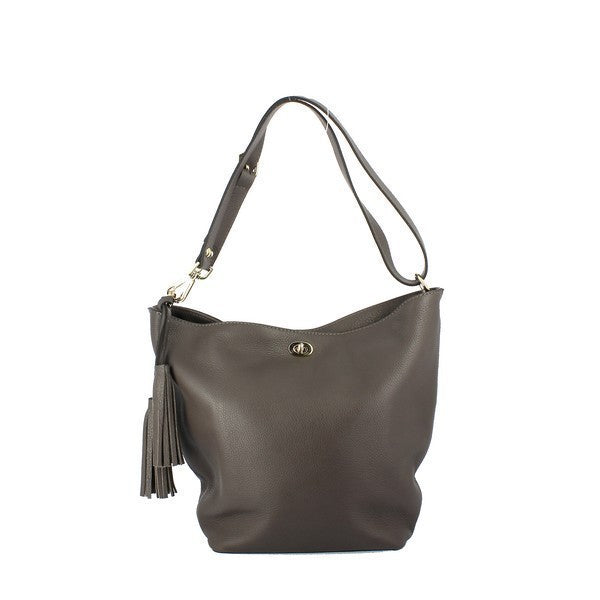 The Bridas 575 Grey Shoulder Bag is showcased against a soft, neutral backdrop, highlighting its elegant design. The bag, made of high-quality leather, features a smooth texture and subtle sheen, with an adjustable strap for versatile carrying options. Its spacious interior is hinted at, showcasing its practicality, while the stylish grey hue complements any outfit, making it an ideal accessory for both casual and formal occasions. 