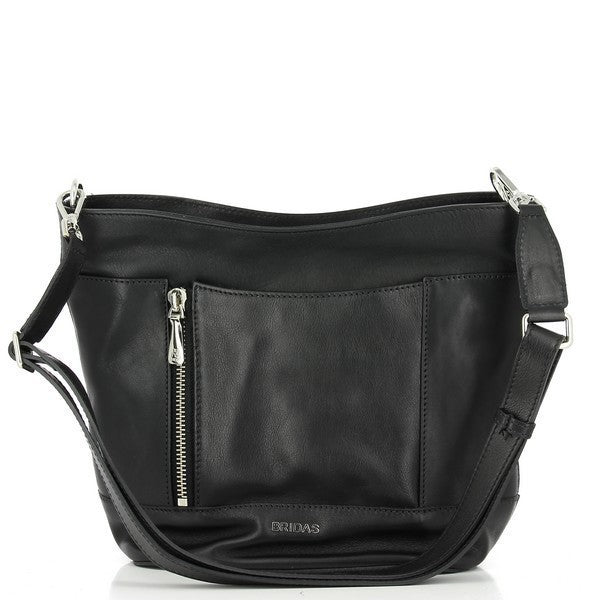 The Bridas 858 Black Crossbody Bag is elegantly positioned on a light, textured surface, highlighting its sleek and modern design. The bag features a smooth black leather exterior with a refined finish, showcasing the quality of craftsmanship. Its compact yet spacious shape is accentuated by the adjustable strap, which is shown hanging alongside for easy access. Intricate stitching details along the edges emphasize the artisanal touch, while the subtle hardware adds a hint of sophistication. 