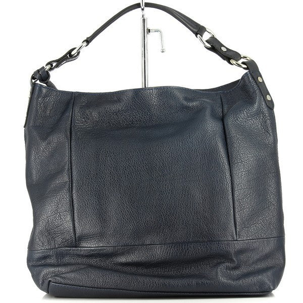 The Bridas 915 Blue Shoulder Bag is elegantly showcased against a soft, neutral backdrop, emphasizing its vibrant blue leather exterior. The bag’s structured design features a spacious interior, ideal for everyday essentials. The adjustable strap is displayed alongside, highlighting its versatility for comfortable wear. Subtle stitching details enhance the bag’s artisanal quality, while the rich color captures attention, exuding sophistication and charm. 