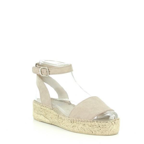 This image showcases the Calzanor 1948 Nude Slingback Espadrilles from a side angle, highlighting the elegant silhouette and smooth leather upper. The soft nude color beautifully complements the round toe design, while the slender slingback strap adds a touch of sophistication. The espadrille’s natural jute sole is partially visible, emphasizing its handcrafted quality.