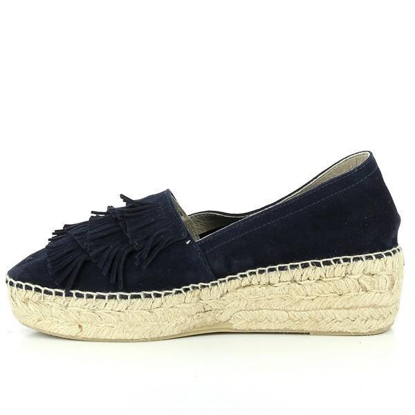 The inside side of the espadrille is displayed, revealing the plush leather lining that promises a soft and comfortable fit. The craftsmanship is evident in the seamless design, with no visible stitching on the interior, ensuring a smooth feel against the foot. The natural jute sole offers a glimpse of its breathable and flexible nature.