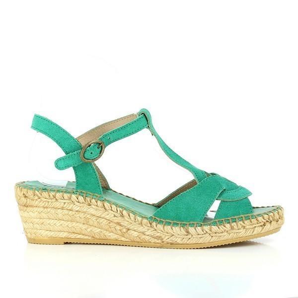 A close-up of the Calzanor A644 Green Slingback Wedge Espadrilles, showing the clean, sleek profile. The leather upper and sturdy wedge heel are clearly visible, highlighting the shoe’s natural green color and elegant design.