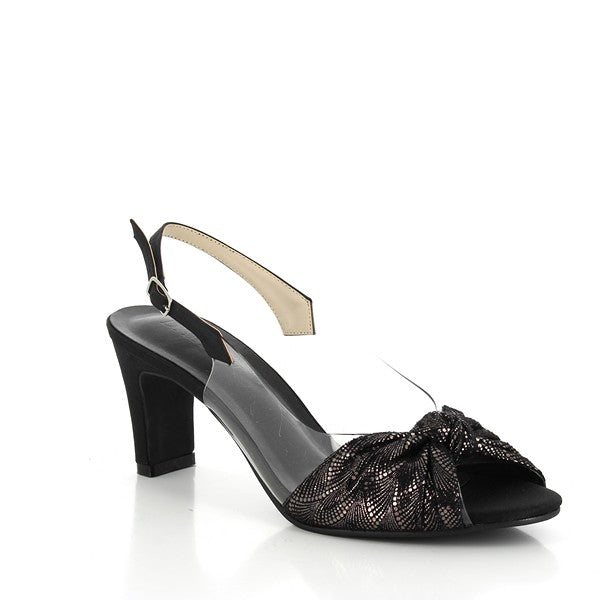 From an angled side perspective, the peep-toe opening and decorative front knot are visible, adding elegance to the sleek design. The transparent side panel complements the metallic sheen, and the slingback strap wraps around the heel in a stylish, supportive arc.