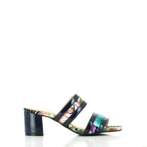 A side view of the Dalessi Dcuba Blue Slides, showcasing the two-strap design with blue-toned tropical motifs and the unique black square heel, giving a modern and exotic feel.

