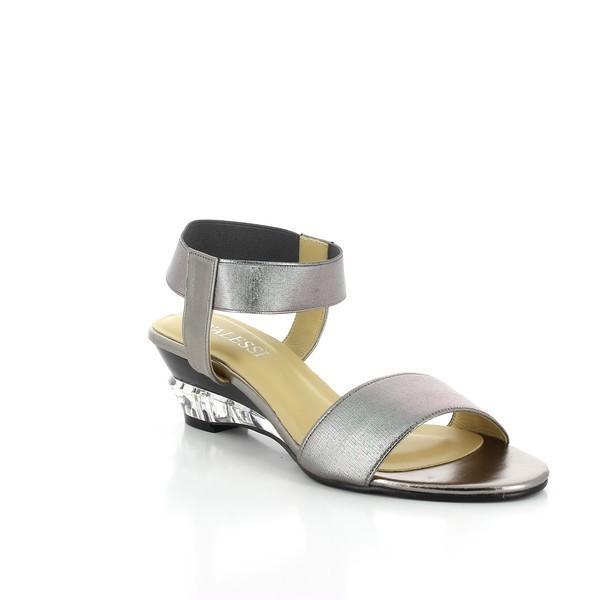 From an angled view, the Dalessi Deluxe Pewter Sandals reveal the elegant transparent wedge heel, adding sophistication to the overall design. The slingback strap with a zipper is clearly visible, enhancing both style and functionality.