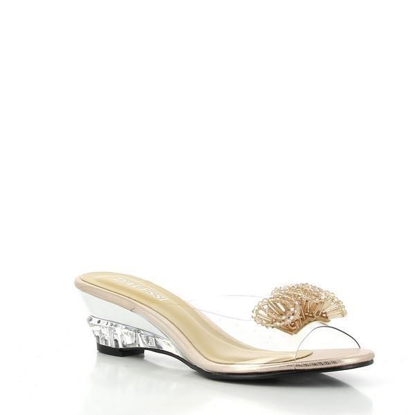 An angled shot of the Dalessi Dualism Gold Slide, emphasizing the elegant transparency of the upper and the intricate flower detail, paired with the soft golden tones of the sole.