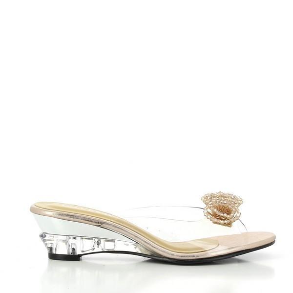 A sleek side view of the Dalessi Dualism Gold Slide, highlighting the transparent upper with a decorative flower and the subtle 2.5 cm heel-platform.