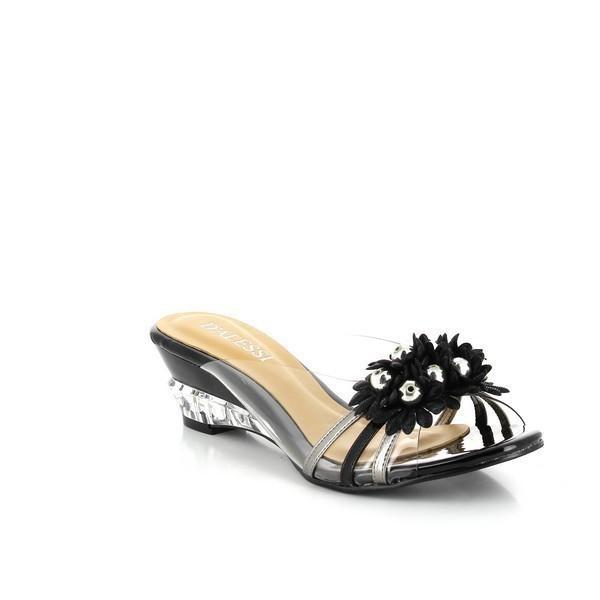 The Dalessi Dupont Black Slides captured from an angle, emphasizing the unique transparent heel and the subtle curve of the leather upper, while the open-toe design provides a fresh and stylish look.