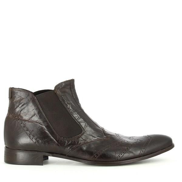 This side view of the Enrico Santi 125 T Moro Dark Brown Chelsea Boots highlights the sleek silhouette and refined brogue detailing. The wrinkled leather texture and visible stitching add a touch of sophistication, while the elastic side panels ensure an easy slip-on design.