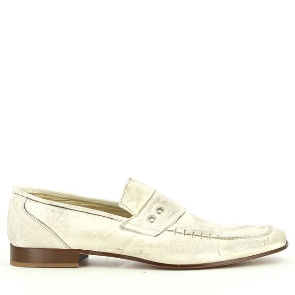A clear side profile of the moccasin, showcasing the soft suede leather material, sleek silhouette, and subtle stitching along the edges. The shoe’s clean, pull-on design is visible, highlighting its smooth, elegant look.