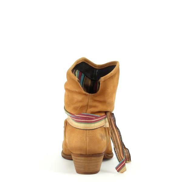 Shows the back of the ankle boot, emphasizing the clean lines and minimalistic design, with a close-up on the heel and decorative strap details.