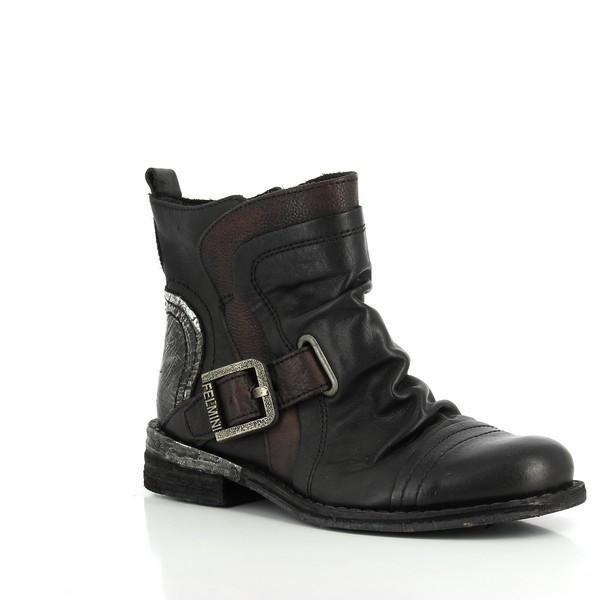 This angled shot emphasizes the boot's sleek silhouette and the unique design of the decorative buckle. The contrasting black and brown leather create a dynamic visual effect, giving the boots a contemporary yet classic look.