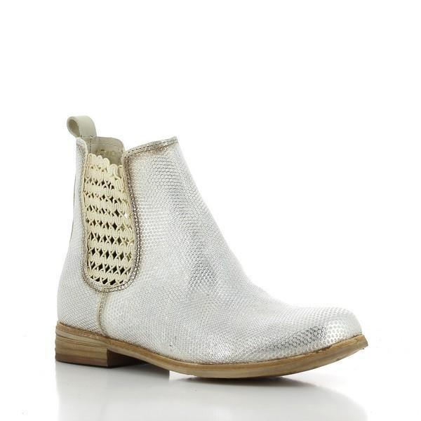 A dynamic angle highlights the ankle boot’s silhouette, emphasizing the clean lines and slight heel-platform height, offering a modern, sophisticated look.