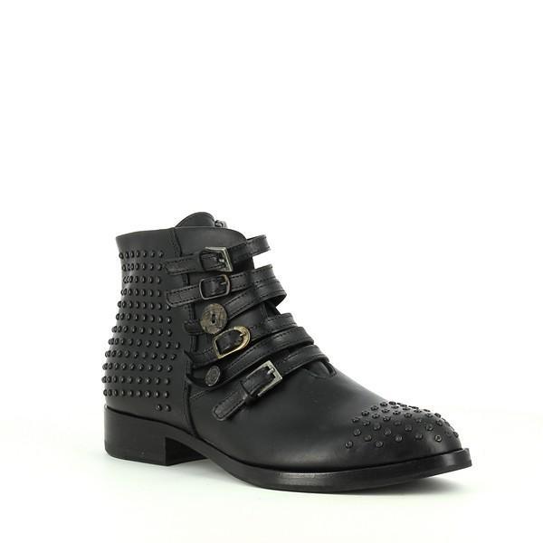 A dynamic angle showing the side of the boot with decorative straps and buckles, along with black studs on the heel and front upper. The polished leather and distinctive stitching give the boot a sophisticated and bold look.