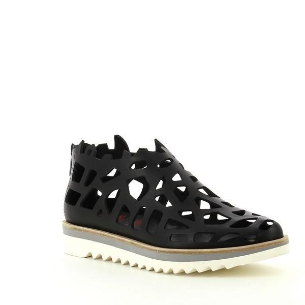 From a side angle, the laser cut detailing becomes more prominent, showcasing the precision craftsmanship. The 5cm heel-platform is visible, giving the sneaker a slight lift while maintaining a sporty and balanced look. The pointed toe shape enhances the contemporary style, making these sneakers stand out.