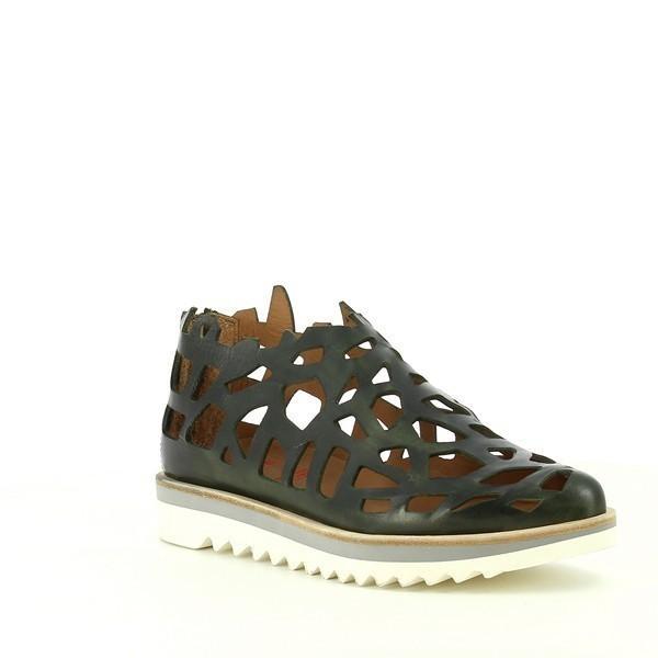 From an angle, the laser-cut pattern is even more pronounced, creating a stunning play of light and shadow on the leather. The 5cm heel-platform is visible, providing a comfortable lift while maintaining a sporty aesthetic. The pointed toe adds a touch of elegance to the casual design, making these sneakers both stylish and versatile.