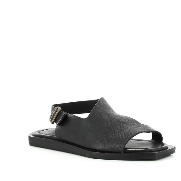 A slightly angled perspective of the sandals, highlighting the textured leather finish, round toe shape, and the elegance of the hand-finished details.