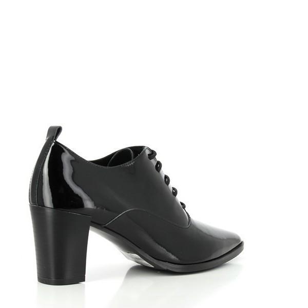 A stylish angled shot of the bootie, highlighting the lace-up design, gently curved silhouette, and the polished finish of the synthetic material.