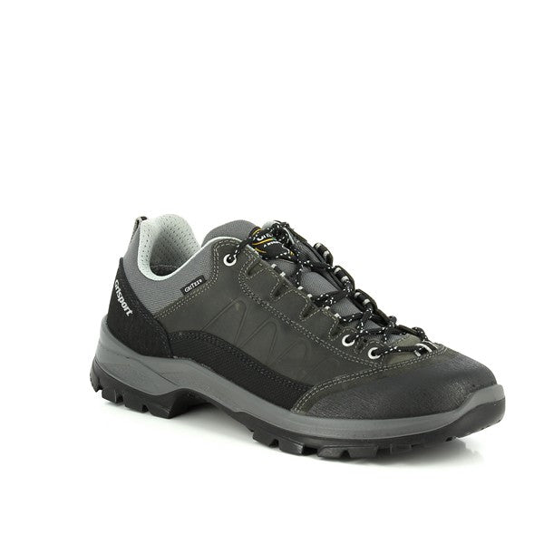 Capturing the Grisport 14509D5G sneakers from an angle, this shot highlights the sneaker’s sleek profile. The combination of leather and synthetic materials in the upper is showcased, giving the shoes a modern yet durable look. The 4cm heel is subtly visible, providing a slight lift and enhancing comfort. The synthetic sole’s tread pattern is also evident, ensuring reliable traction for various outdoor terrains.