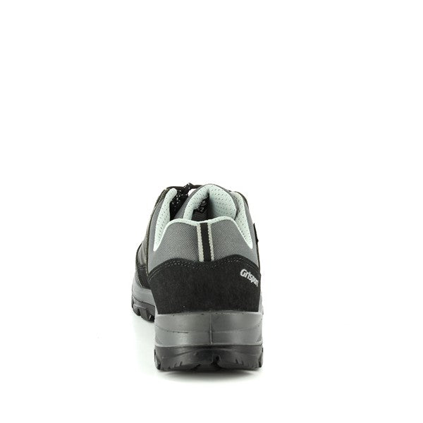 The back view of the Grisport 14509D5G sneakers emphasizes their sturdy and well-constructed design. The 4cm heel is clearly visible, offering added support and balance. The leather and synthetic materials continue to create a stylish yet functional look, while the synthetic sole’s tread pattern provides a clear indication of its reliable traction. The back profile highlights the high-quality craftsmanship that Grisport is known for, ensuring durability and comfort for outdoor activities.