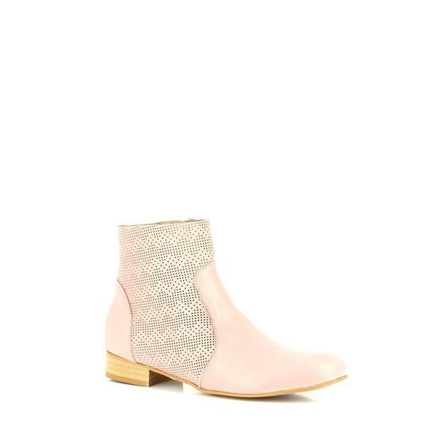 A stylish perspective highlighting the smooth nude leather, round toe shape, and breathable cut-out design that adds a touch of modern elegance.