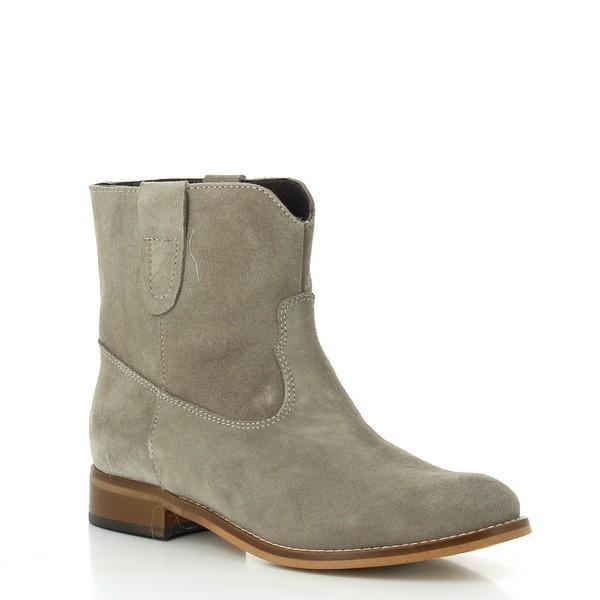 A dynamic perspective highlighting the graceful curve of the boot, with the elastic side panel adding flexibility and ease, perfect for a casual yet chic look.
