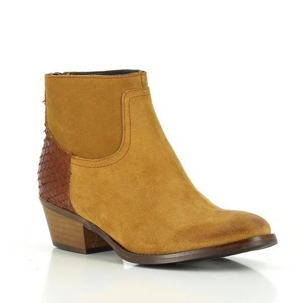 A dynamic shot capturing the boot's sleek silhouette, highlighting the contrast between the rich camel brown leather and the textured snake print tan ankle.