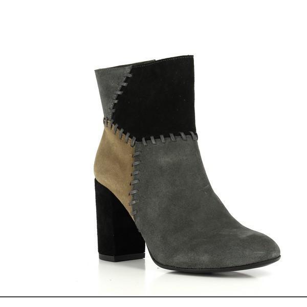A dynamic angle of the Igualados MC-17 Ankle Boots, highlighting the contrasting color panels and the sleek leather craftsmanship. The inner zipper is subtly visible, providing a practical and stylish detail.