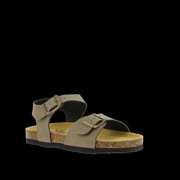 An angled view of the sandals reveals the stylish design and craftsmanship. The soft taupe leather contrasts beautifully with the cork sole, highlighting the eco-friendly materials used in construction. The adjustable slingback strap ensures a secure and customizable fit.