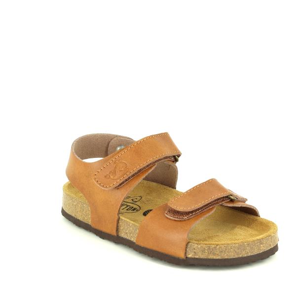 A pair of Plakton's 125093 Tan Slingback Kids Sandals displayed against a neutral backdrop. The sandals feature a high-quality leather upper and lining, adjustable Velcro straps, and a secure ankle strap. The cork sole with a 2cm platform provides comfort and support, while the memory cushion technology ensures a perfect fit. The round toe shape and ridged sole highlight superior traction and flexibility, ideal for active kids.