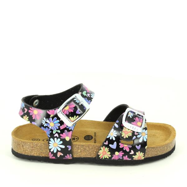 This image captures the side profile of Plakton's 131407 Black Multi Floral Kids Sandals, showcasing the intricate floral design against the sleek black leather upper. The natural cork sole with a 2cm heel-platform is visible, highlighting the perfect blend of style and comfort.