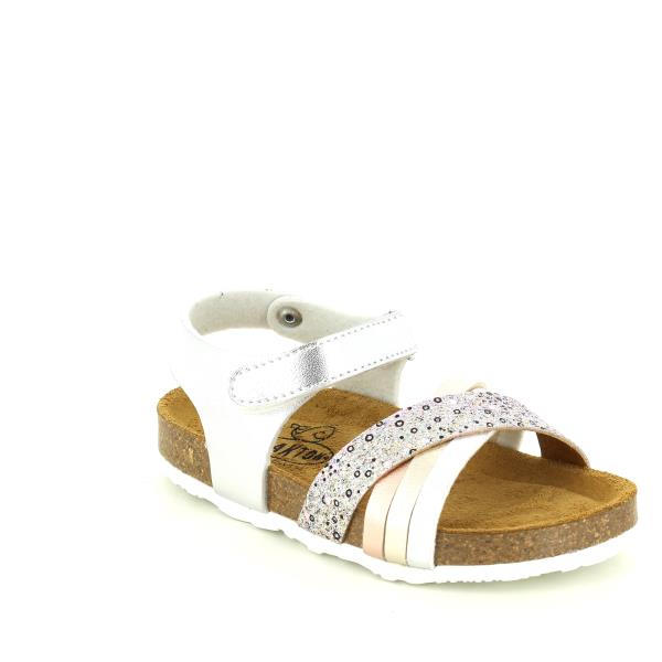 Captured at a stylish angle, this photo showcases the sandal's elegant silhouette and rounded toe shape. The metallic/multicolour leather print reflects light beautifully, while the adjustable velcro strap ensures a secure fit for active kids.