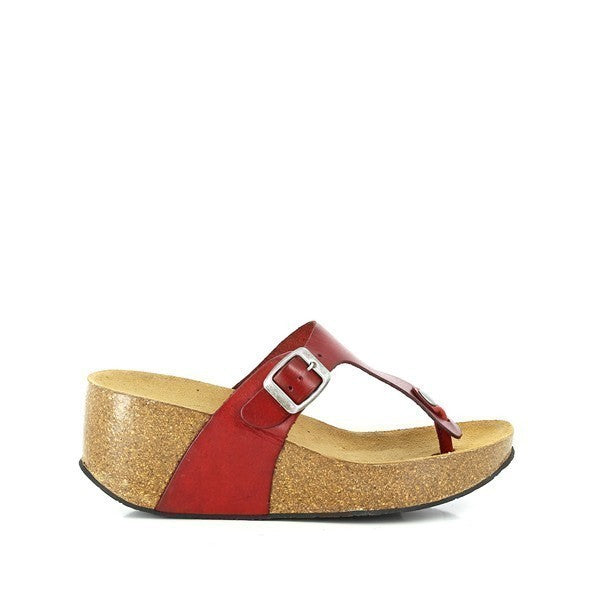 A detailed image capturing the side profile of Plakton's 271672 Red Thong Wedges. The vibrant red leather upper contrasts elegantly with the natural cork sole, showcasing the shoe's stylish design and craftsmanship. The adjustable buckle strap is visible, highlighting its functionality and ensuring a personalized fit.