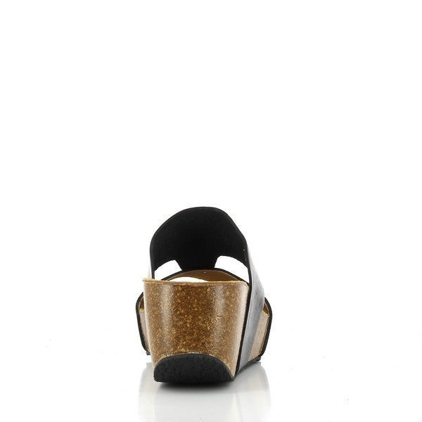 Plakton's 275171 Black Leather Wedges capture from an elegant angle, revealing the chic round toe shape and cork footbed for stylish comfort.