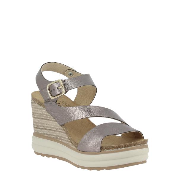 Capture an angled perspective to highlight the intricate details of the sandals, including the premium leather upper and the adjustable ankle strap. This angle showcases the craftsmanship and design elements that make these wedges both fashionable and functional.