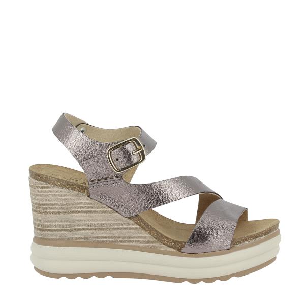 Showcase the sleek profile of Plakton's 375900 Silver Slingback Wedges, highlighting the stylish multi-strap design and the elegant 9cm cork wedge heel. This view emphasizes the modern and sophisticated look of the sandals, ideal for various occasions.
