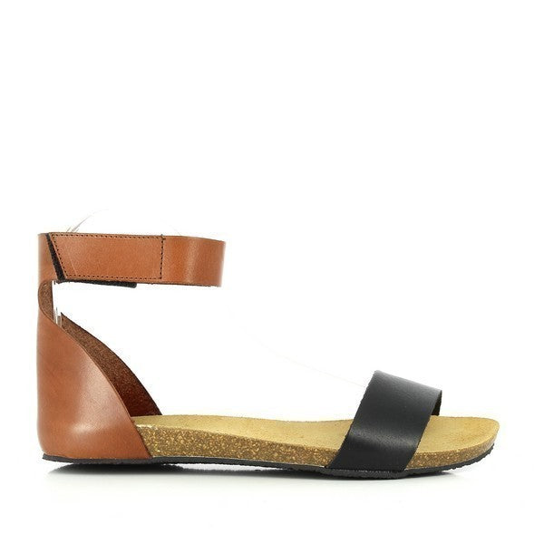 Capture the sleek side profile of Plakton's 575130 Tan & Black Slingback Sandals. Crafted from premium leather with a cork sole, these thong sandals offer comfort and style in every step.