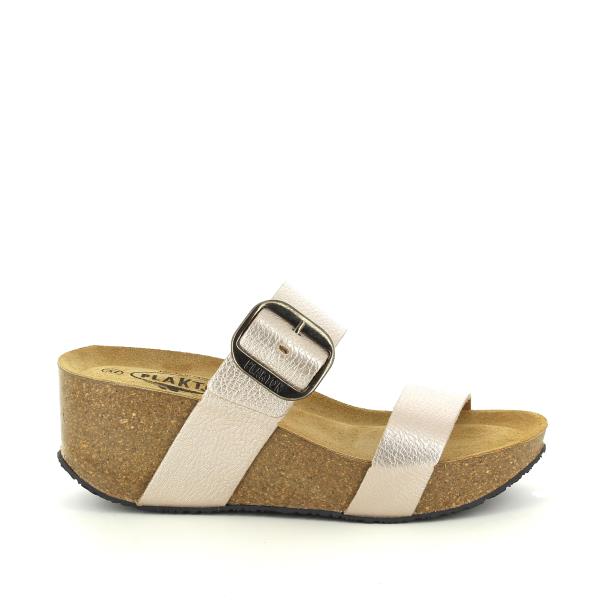 A sleek side view of the Plakton 873004 White Pearl Wedges, showcasing the elegant white pearl leather upper and the comfortable cork wedge heel that provides both style and stability.