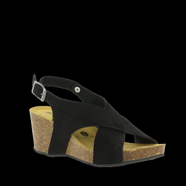 Captured at an angle, this shot highlights the stylish cross-straps and the curve of the 7cm wedge heel. The round toe shape and supple leather lining are visible, offering a glimpse of both comfort and craftsmanship.