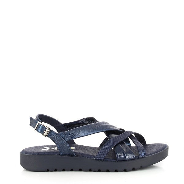 A pair of 24 Hrs 24087 Blue Slingback Sandals is displayed on a neutral background. The sandals feature a vibrant blue leather upper with thin cross straps that elegantly frame the foot. An adjustable buckle fastening ensures a secure fit, while the 2 cm heel provides a subtle lift. The round toe design offers a comfortable fit, and the soft leather lining is visible from the top, highlighting the attention to comfort and quality. The overall design combines a bold color with classic elements for a sophisti