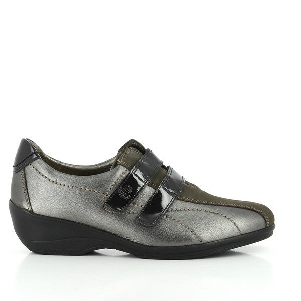 The 24 Hrs 22985 Charcoal Pewter Sneakers are shown from the side, highlighting the sleek charcoal pewter leather upper. The round toe design and modern aesthetic are complemented by the two velcro fasteners for a secure fit.