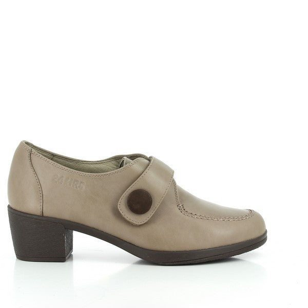 A pair of 24 Hrs 23047 Taupe Booties featuring a refined leather upper with a decorative strap and button detail. These women’s booties are designed with a round toe and a comfortable 4 cm heel-platform. The leather lining and synthetic sole provide durability and comfort. Made in Spain, they exemplify 24 Hrs' commitment to quality craftsmanship.