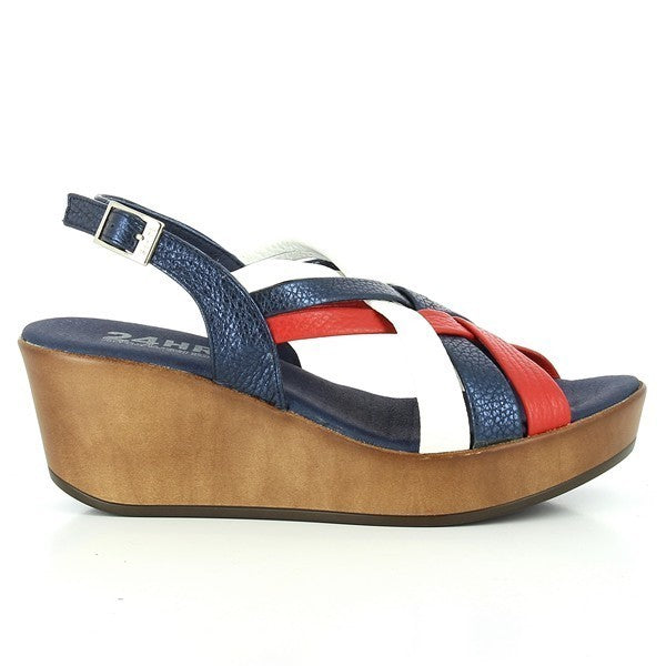 The 24 Hrs 23312 Navy Braided Slingback Sandals are displayed against a neutral background. The sandals feature a striking navy leather upper with a unique braided design, complemented by vibrant red, white, and navy straps. The adjustable buckle ensures a secure fit, while the 6 cm heel-platform adds a sophisticated lift. The classic round toe shape and the high-quality leather lining and durable synthetic sole highlight the expert craftsmanship of these Spanish-made sandals, perfect for a stylish and comf