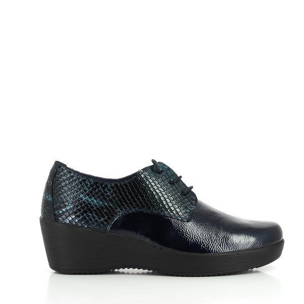 A close-up image of the 24 Hrs 23416 Navy Lace Up Shoes, showcasing the rich navy leather upper and elegant design. The soft leather lining and 5 cm heel are visible, highlighting the shoes' comfort and style. The durable synthetic sole is shown, emphasizing functionality and craftsmanship. The neutral background enhances the refined details and sophisticated appearance of these women's lace-up shoes.