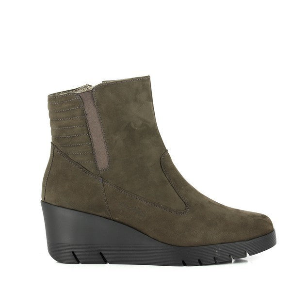 A detailed close-up of the 24 Hrs 23452 Brown Ankle Boots, highlighting the rich leather upper and round toe shape. The photo captures the 6 cm heel-platform, providing a subtle lift, and the sleek design that includes an inside zipper for easy wear and an outside elastic band for added comfort. The soft leather lining and durable synthetic sole are also visible, showcasing the quality craftsmanship that defines these stylish women's shoes. The rich brown color and classic silhouette make these ankle boots 