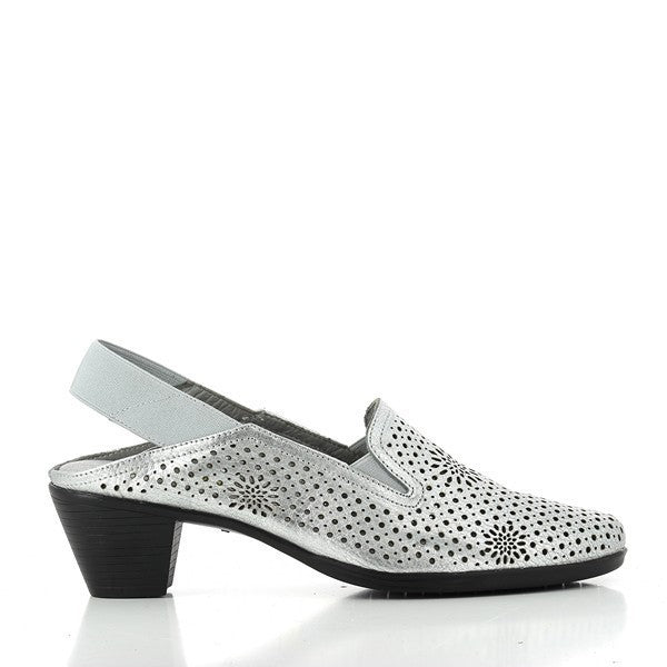A pair of 24 Hrs 23598 Silver Slingback Low Heels are displayed on a neutral background. The heels feature a shiny silver leather upper with a sleek, smooth finish. The slingback design includes an elastic band at the heel for a secure and comfortable fit. The round toe shape and 2.5 cm low heel are visible, highlighting the elegant and practical design. The soft leather lining is slightly visible, showcasing the luxurious interior, while the synthetic sole peeks out from the bottom, emphasizing the durabil