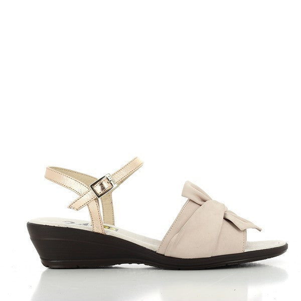 A pair of 24 Hrs 23635 Pink Slingback Sandals is displayed against a simple, neutral backdrop. The sandals feature a soft pink leather upper with a smooth finish, adding a touch of elegance. The 4.5 cm heel is visible, offering a comfortable lift. The slingback design includes an adjustable strap for a secure fit. The round toe shape and soft leather lining are highlighted, emphasizing comfort. The durable synthetic sole is slightly visible, showcasing the quality craftsmanship of these stylish women’s sand